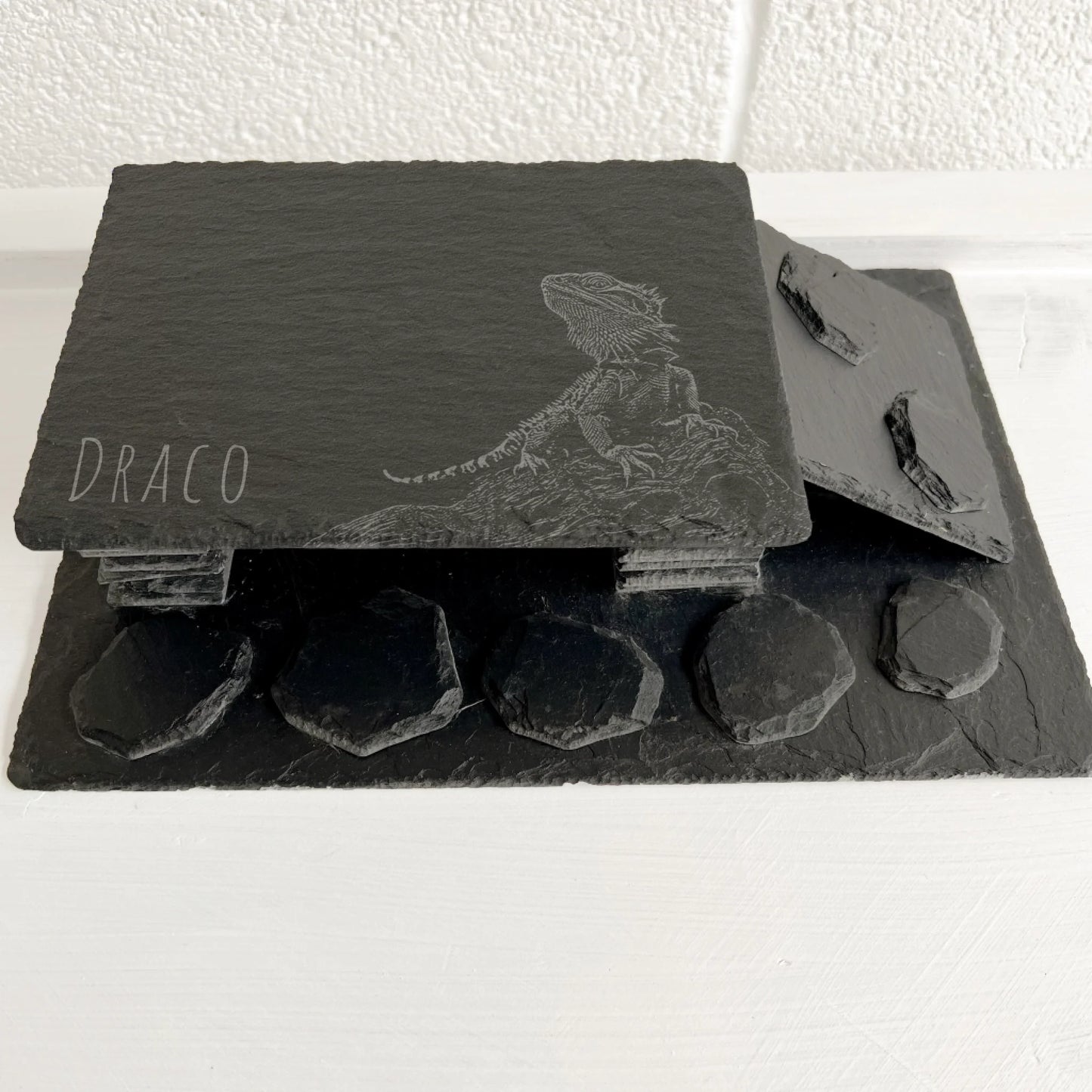 Bearded dragon Handmade black slate reptile hide with ramp on one side and natural stacked-stone texture.